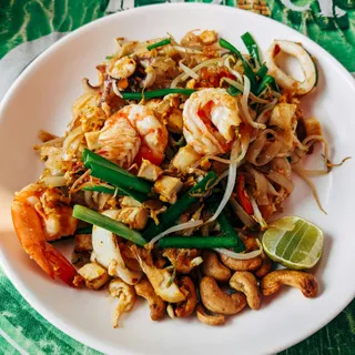Pad thai noodles with prawns, bean sprouts, lime and crushed peanuts.